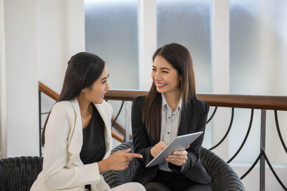 Two Businessmen Looking Tablet Use Tablet (1)