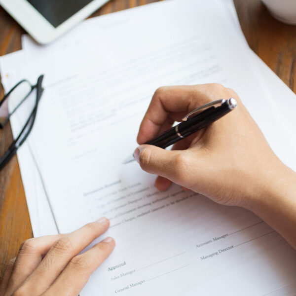 Unrecognizable man filling application form Unrecognizable man filling application form. Businessman checking papers. He signing document. Manager working with report. Financial report concept