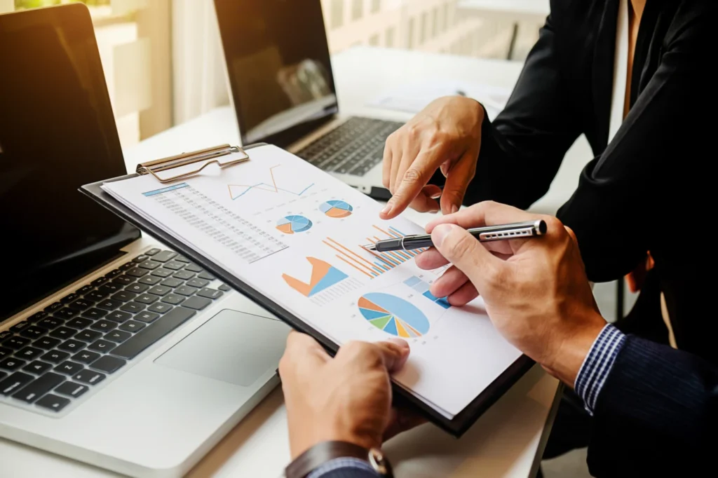 Reviewing financial charts and reports