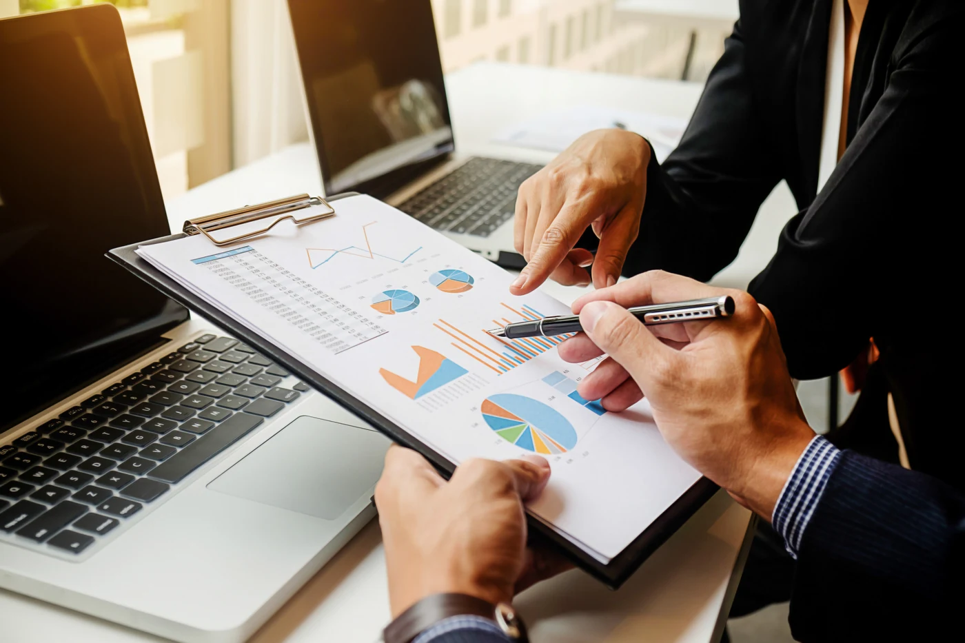 Reviewing financial charts and reports